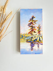 Canadian landscape painting of sun shining through trees on a lake
