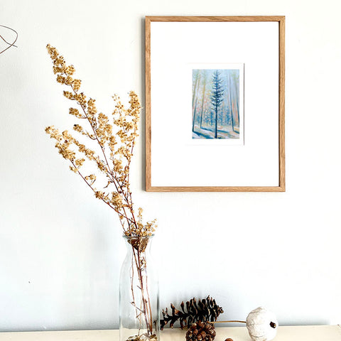 Pine tree print in a frame on the wall