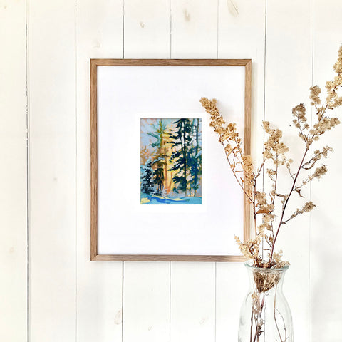 framed forest print on wall
