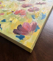a close up of a flower art painting in yellow, pink and blue