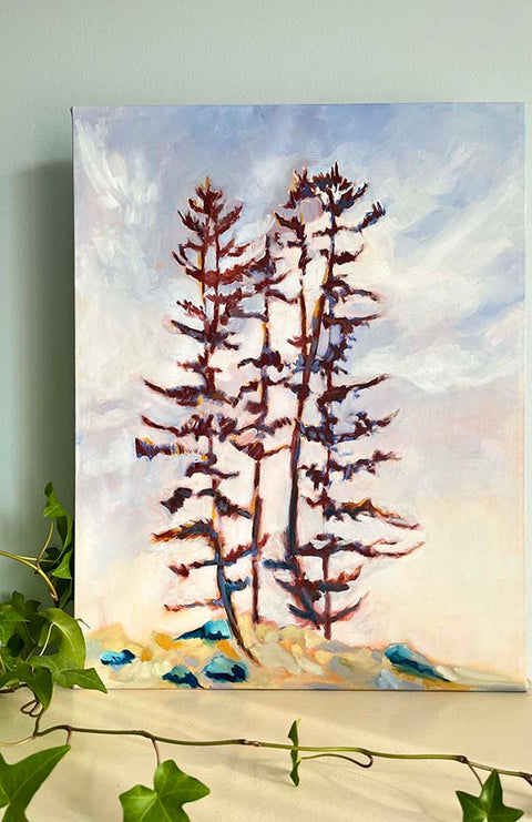 A Canadian landscape painting of tall Muskoka pine trees and a blue sky